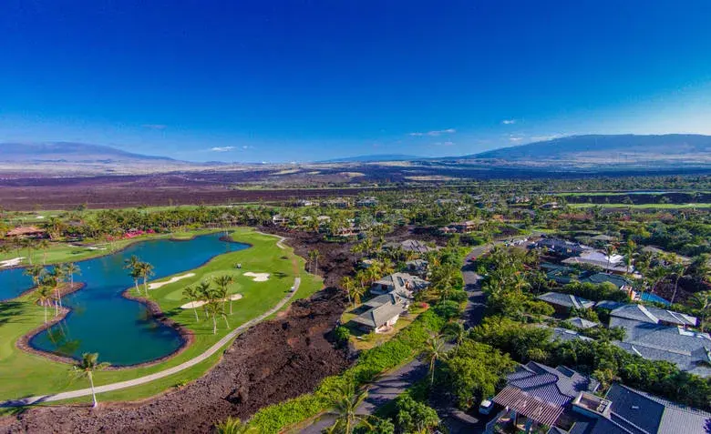 Come home to this idyllic getaway just steps from the secluded coast of Honoka’ope Bay on the Big Island’s famed Kohala Coast. Ensconced within the exclusive Mauna Lani Resort, this expansive Big Island estate is one of only 49 homes in a small resort com