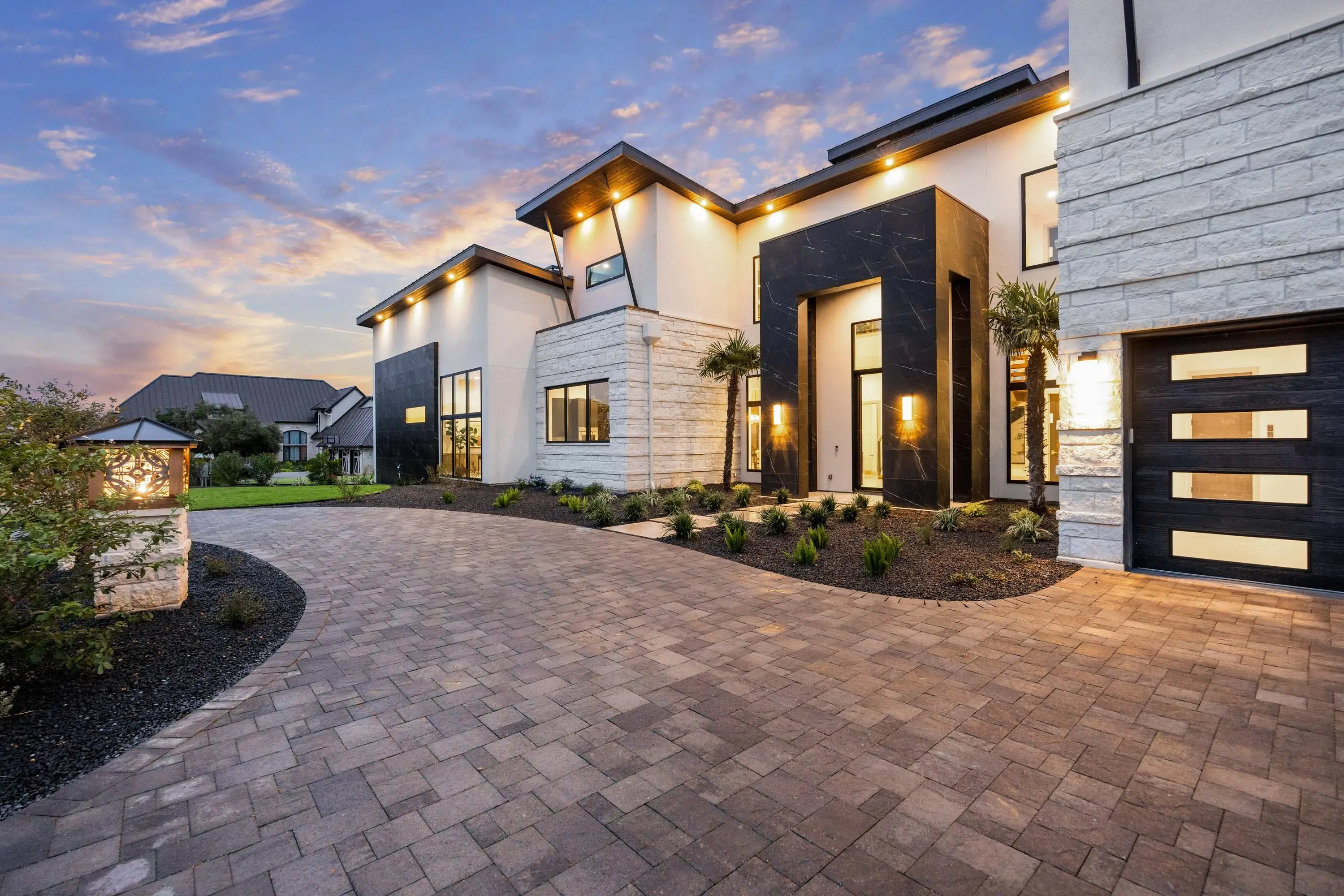Black Onyx Lake Estate is a newly constructed waterfront masterpiece by Grubbs Construction, offering an elevated standard of luxury within the private, guard-gated enclave of Applehead Island. Direct access to Lake LBJ is enhanced by a private boat slip 