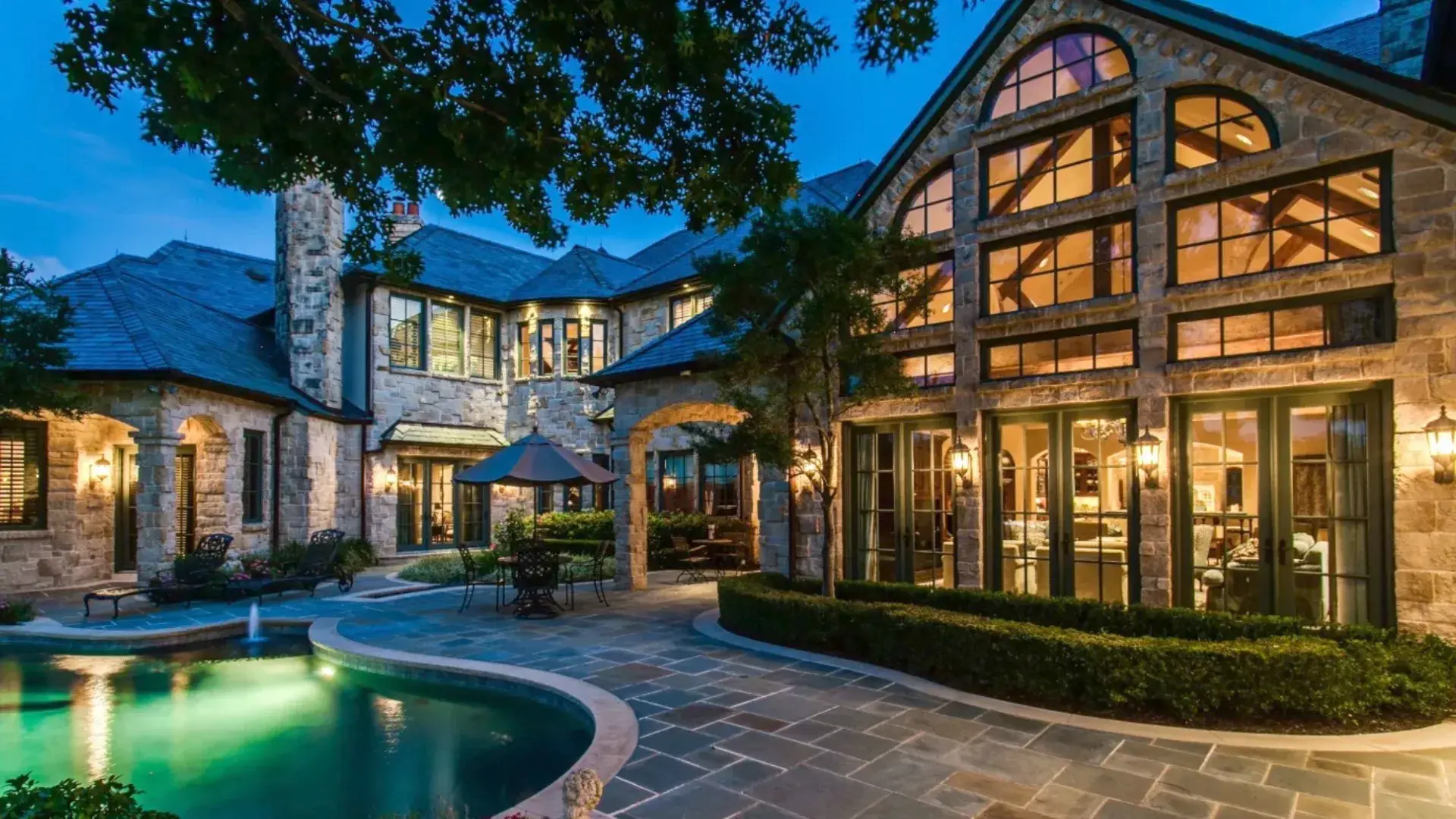 Discover old-world luxury seamlessly blended with modern amenities at 6413 Old Gate Road – a grand estate offering both family comfort and endless entertainment. Drive up the winding bluestone driveway and be greeted by bronze lion statues and a stately e