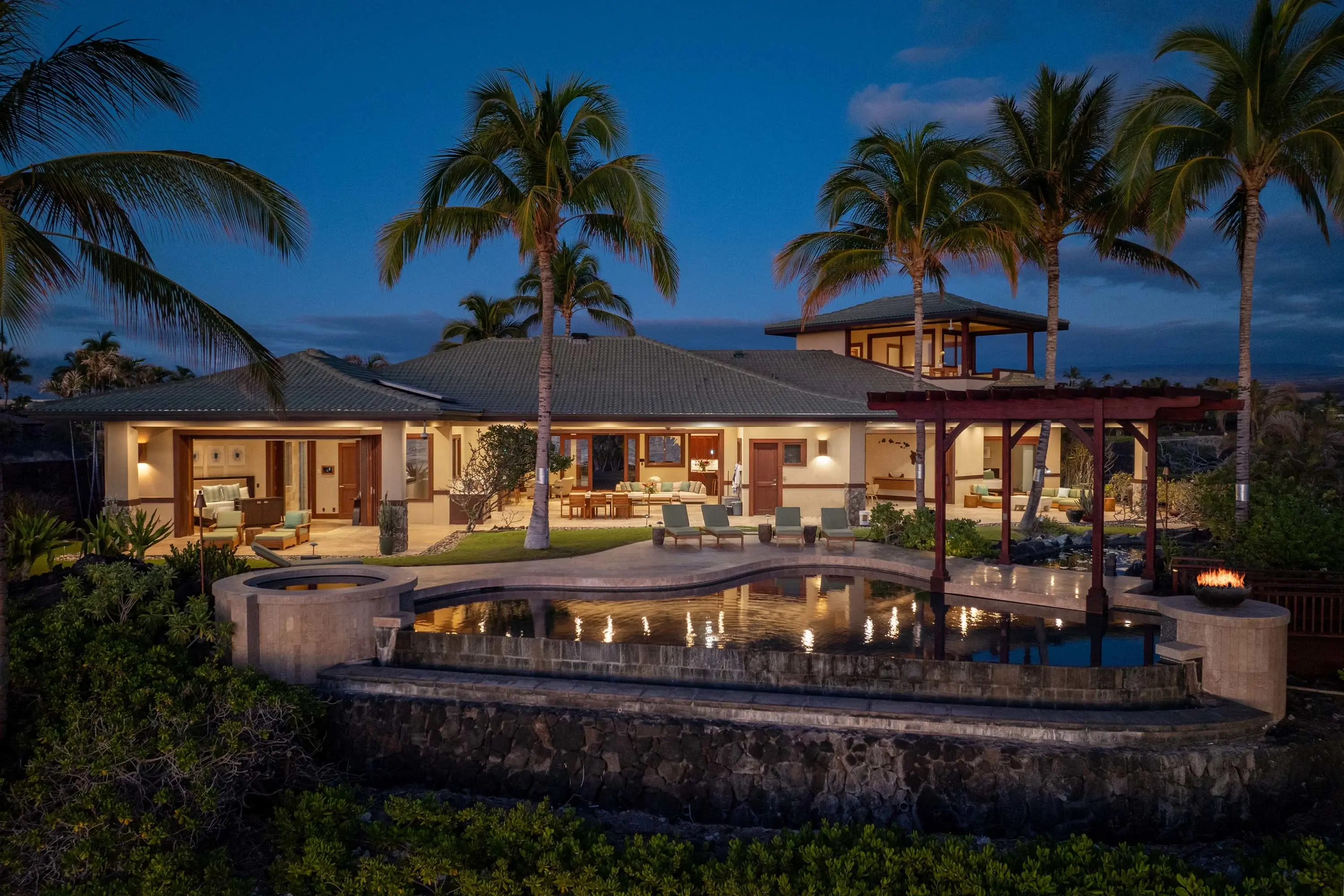 Situated on the tranquil shores of Anaehoʻomalu Bay on Hawaiʻi’s Big Island, Pacific Sunset Villa is a rare sanctuary offering unparalleled coastal luxury. This expansive residence boasts 124 feet of direct oceanfront access within an exclusive 12-lot gat