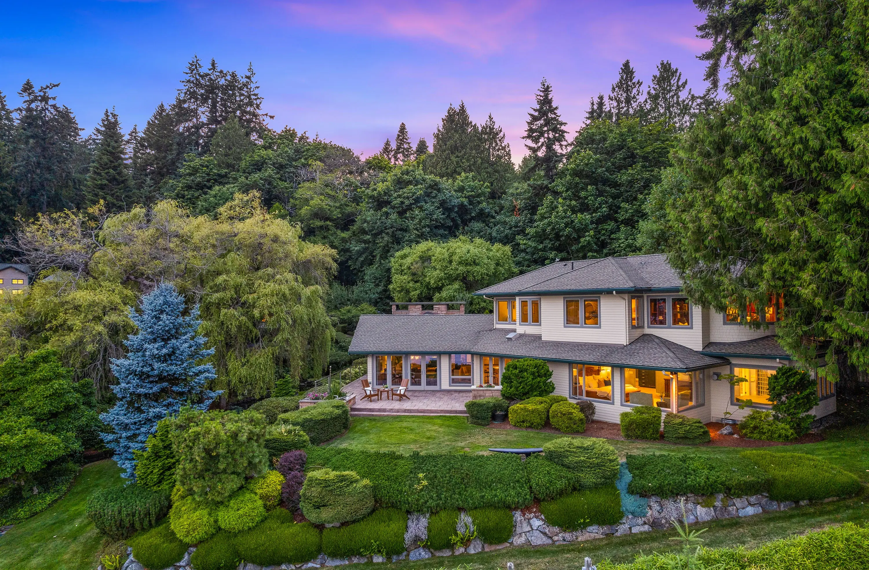 The Miller Bay Estate represents an extraordinary vision of Pacific Northwest living, spanning over five acres with 246 feet of pristine low-bank waterfront. 