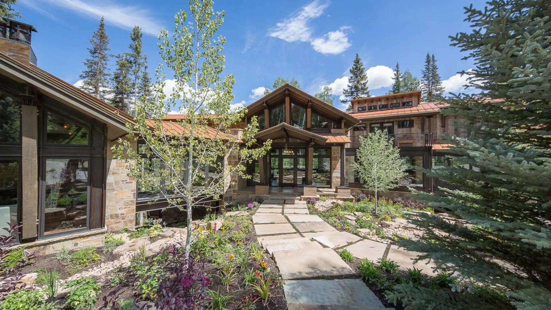 Find tranquility amongst a grove of aspen trees at 109 Polecat Lane. Surrounded by gorgeous mountain vistas, nature beckons from beyond sleek walls of glass and windows. This 7,900+sf estate showcases expert modern architecture with three distinct living 