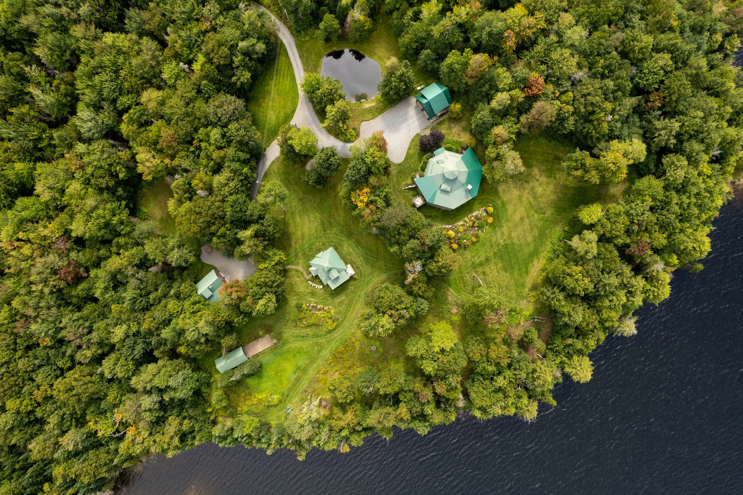 Escape to Ondine, a tranquil Vermont estate on the edge of Green River Reservoir State Park, offering unparalleled seclusion on over 15 acres with private lakefront.