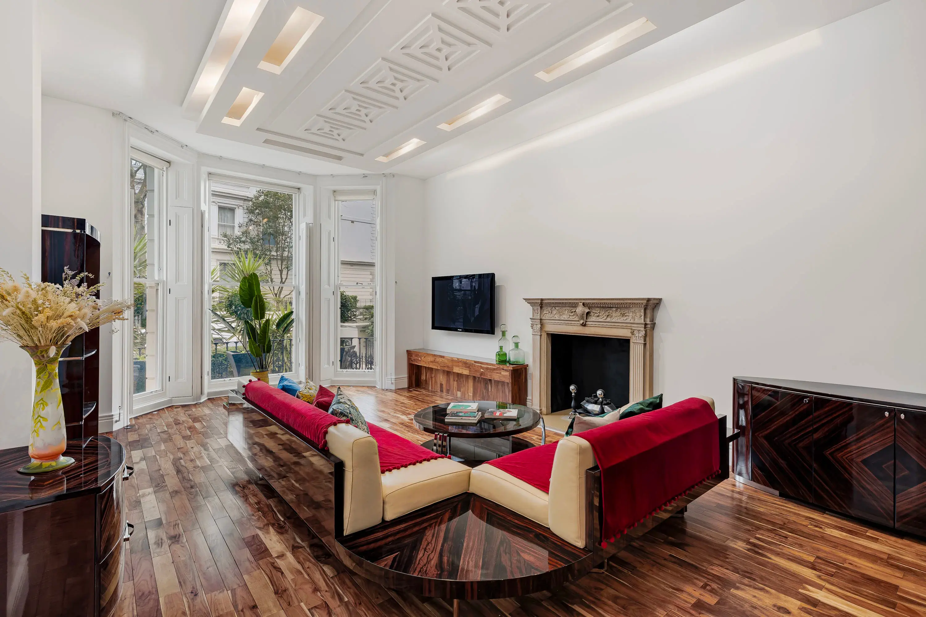 The thoughtfully designed floor plan showcases a gourmet kitchen with Miele appliances and a generous reception room that opens to a private balcony. 