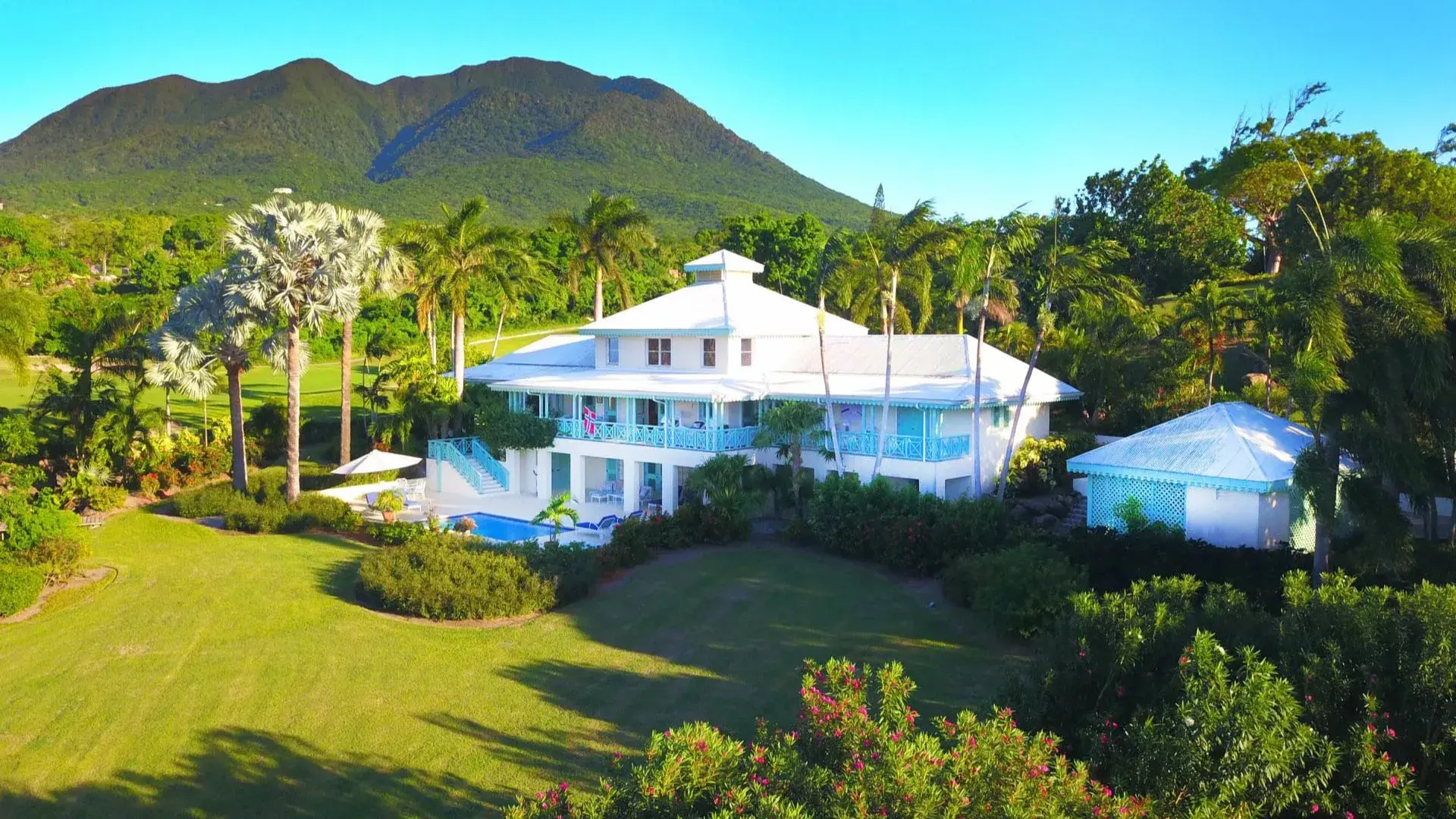 Be pampered in the Caribbean with Four Seasons luxury at the Nevisian Grand Villa within Mahogany Hill Estates at the Four Seasons Resort Nevis. The hilltop vantage point of this magnificent villa allows the lush, natural beauty and sea breezes to permeat