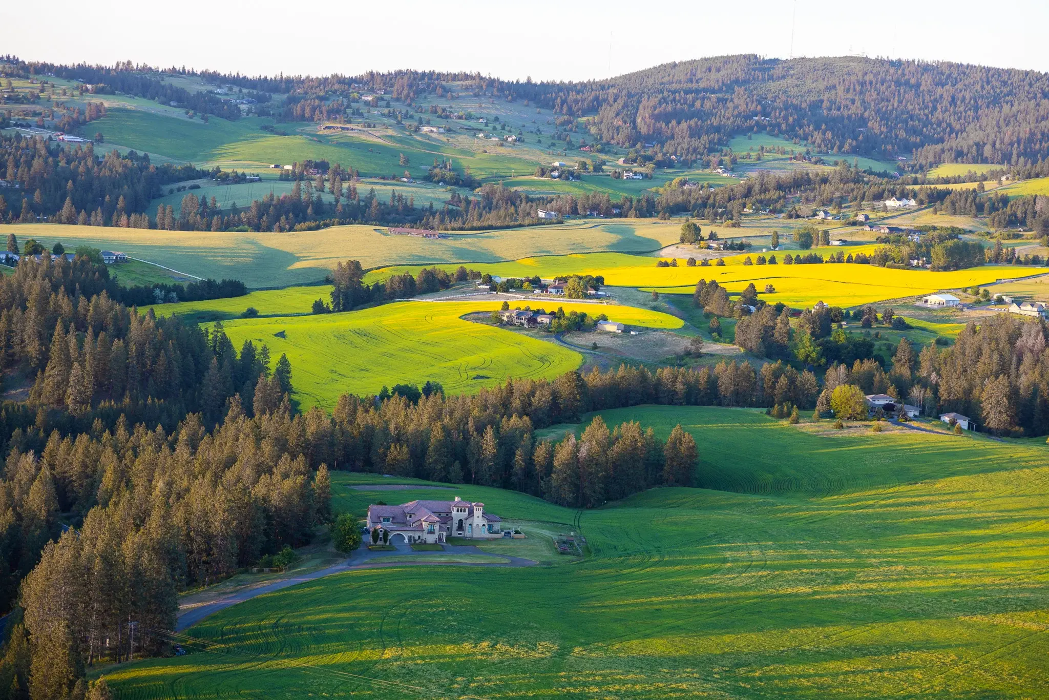 This gorgeous Tuscan-style estate features high-quality imported materials and high-end modern amenities. This five-bedroom, 11,000-plus square foot home brings the beauty of Old World design to the Pacific Northwest. The exterior has warm stone, arched w