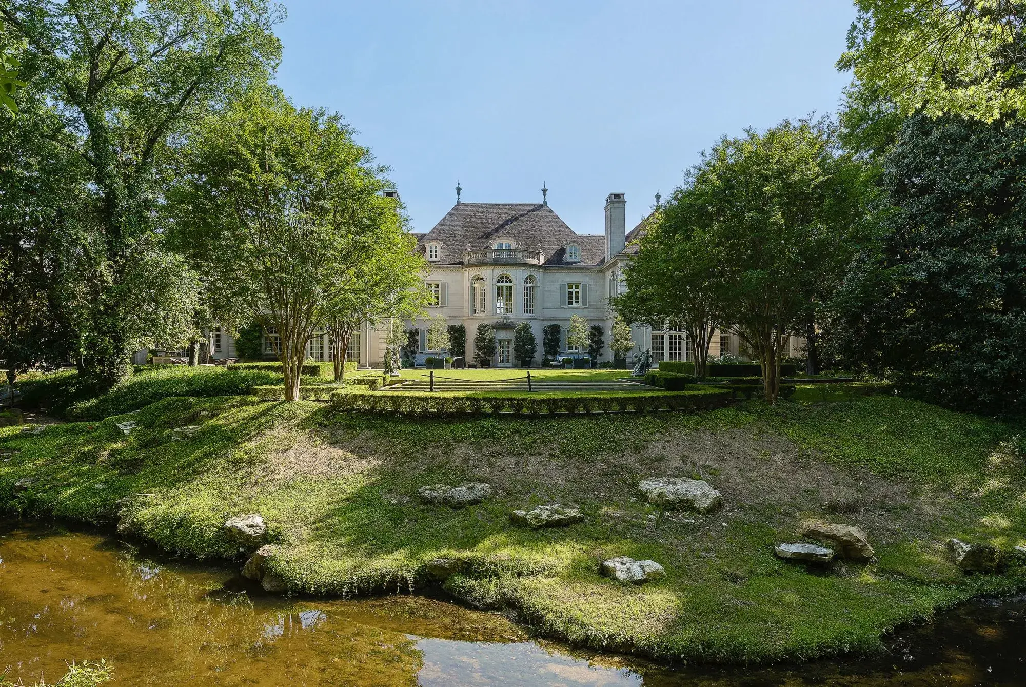 A Legacy of Luxury: Hidden behind wrought iron gates, in exclusive Preston Hollow, is perhaps the most impressive and architecturally significant private estate in the country. Walnut Place, the breathtaking limestone mansion designed in 1938 by world-ren