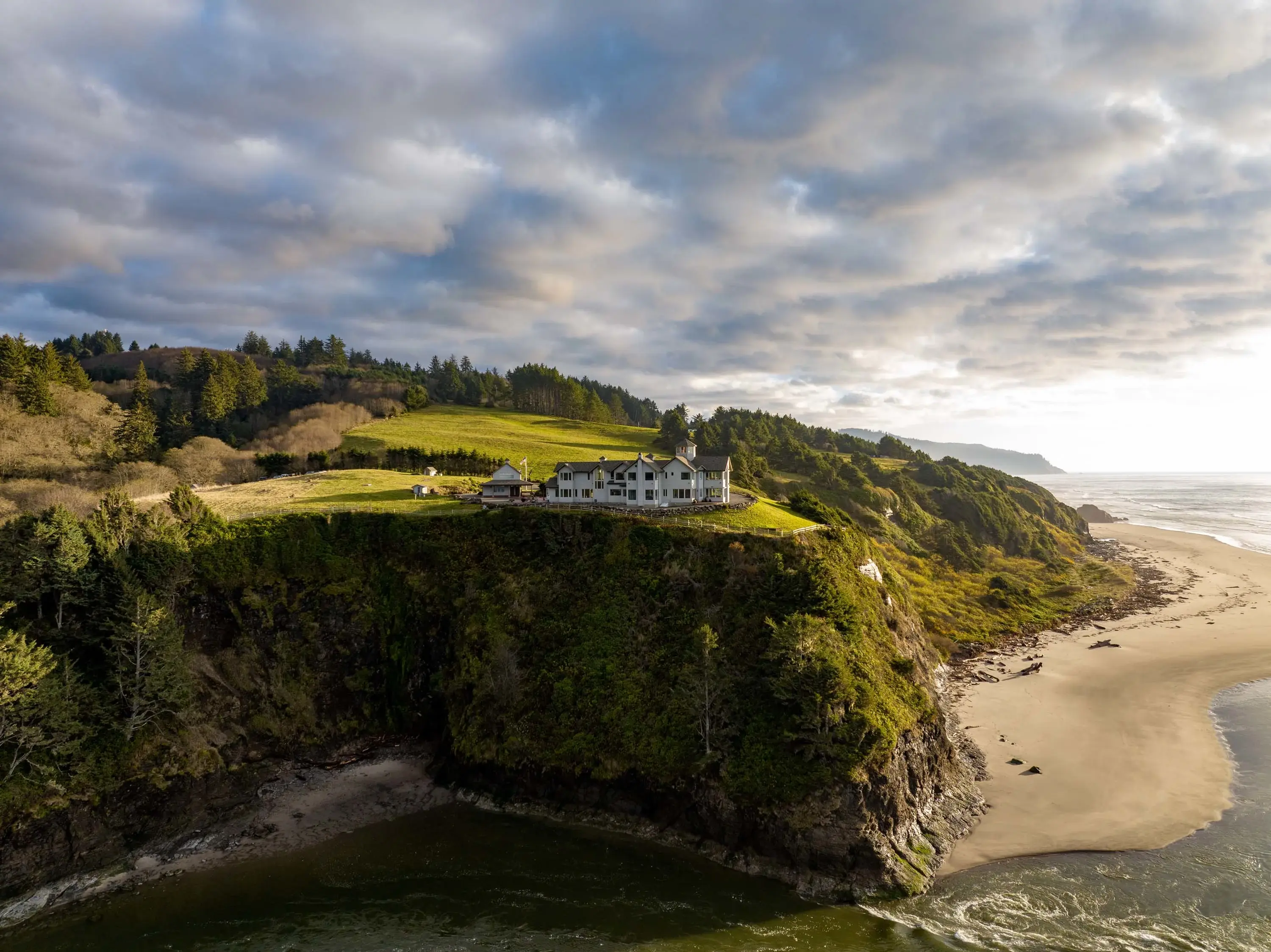 Ocean and river views as far as the eye can see beckon from the Central Oregon Coast. Enjoy a private oasis surrounded by windswept grasses, rocky beaches, and unobstructed views of sea stacks rising from the ocean. Nearly every interior wall offers abund