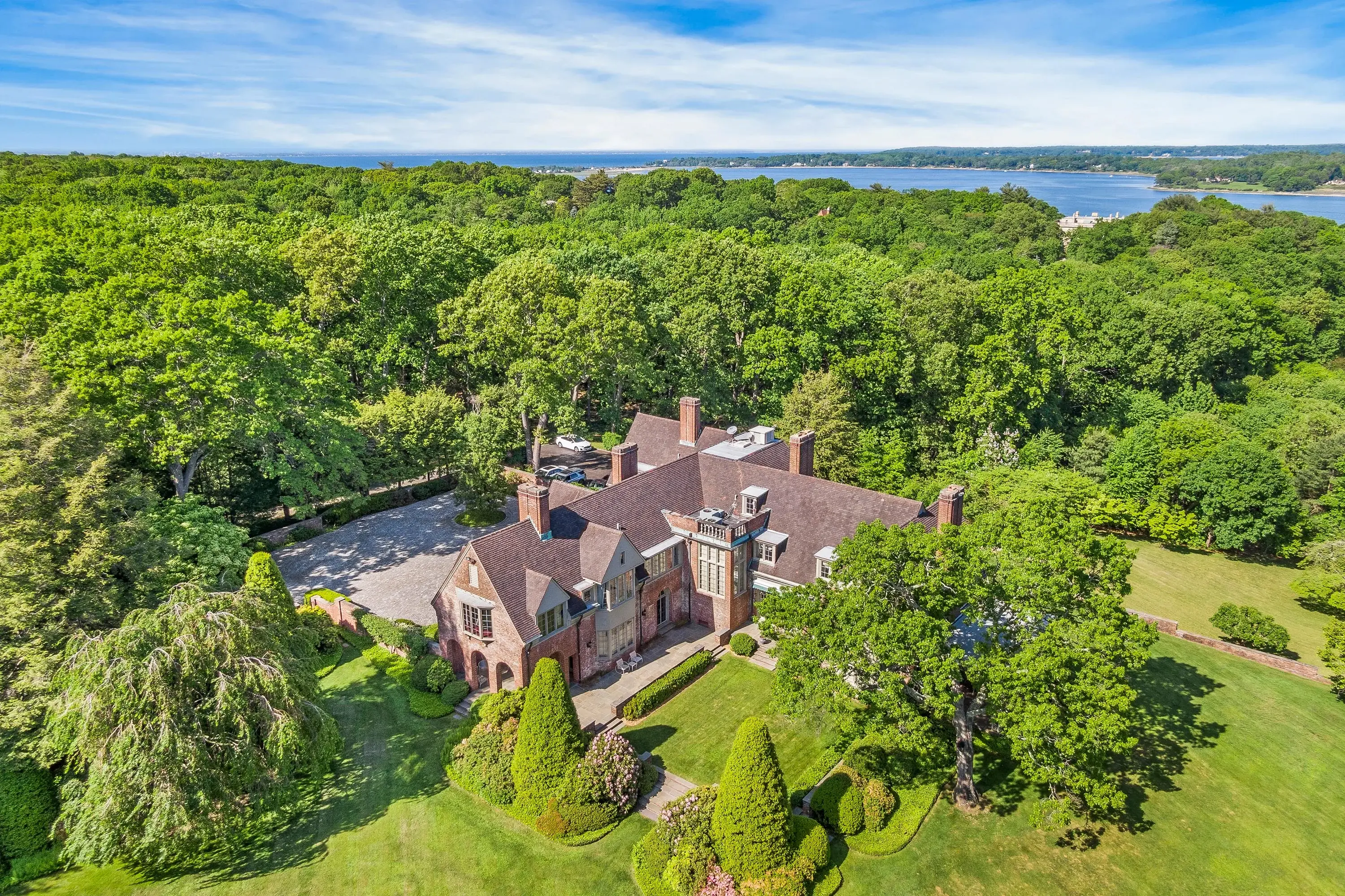 Historic Laurel Hill, an immaculate Tudor manor once owned by the Rockefellers, boasts sweeping hilltop views of Oyster Bay just one hour from Manhattan.