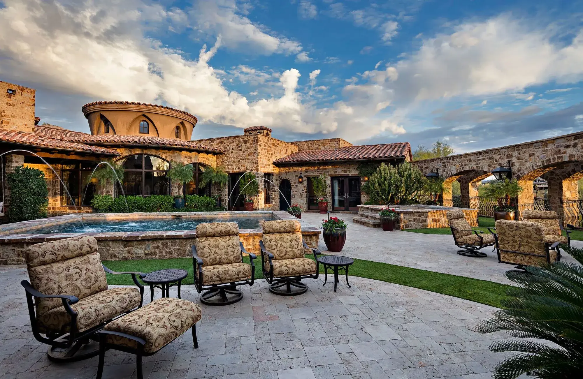 Come home to the finest in indoor-outdoor desert living at The Estancia Club. Custom details will delight you inside and outside this enchanting estate. Designed with the car lover in mind, glass walls between the underground garage and the wet bar create