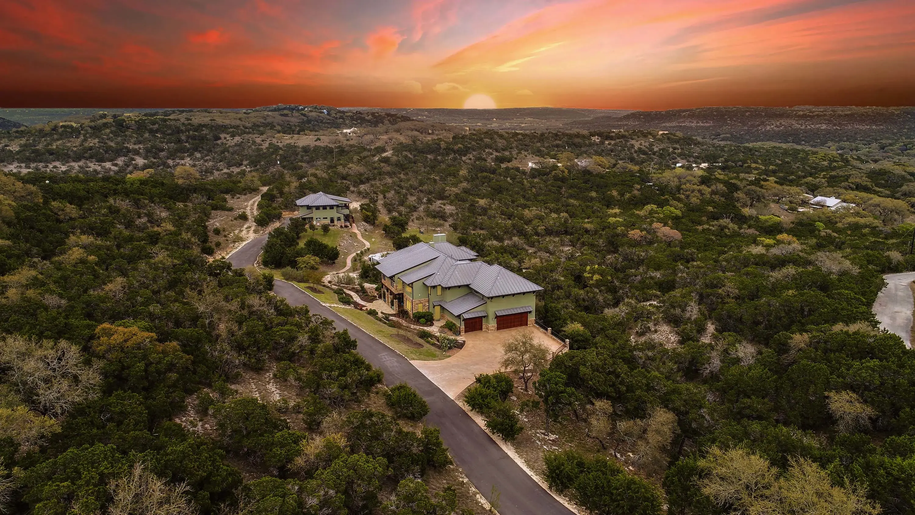 Two exquisite homes on dramatic view acreage create an unparalleled resort-style compound overlooking Wimberley Valley.