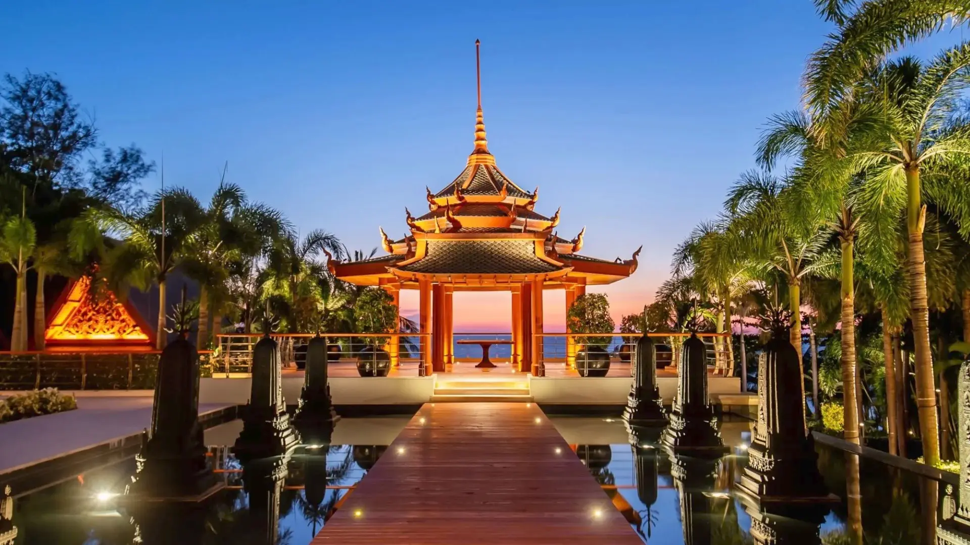 Perched at the top of a cliffside oceanfront setting at the exclusive Trisara resort, Villa Siam offers two-in-one residences, two infinity pools, and 5-star amenities.