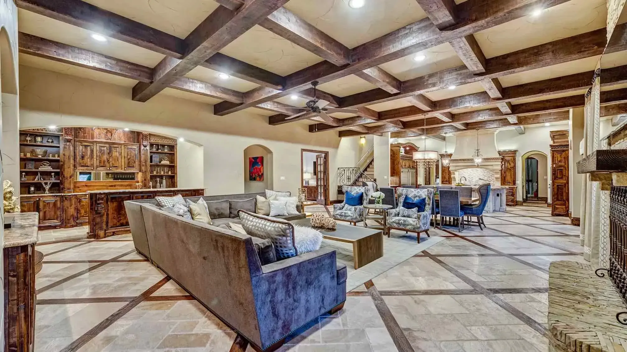 Tucked away on two acres of breathtaking landscape, this 9,998sf estate is the mecca of all things luxury. Enter the grand foyer to be greeted with a sweeping grand staircase and dazzling details. Gorgeous stone and wood accents delight you at every turn 