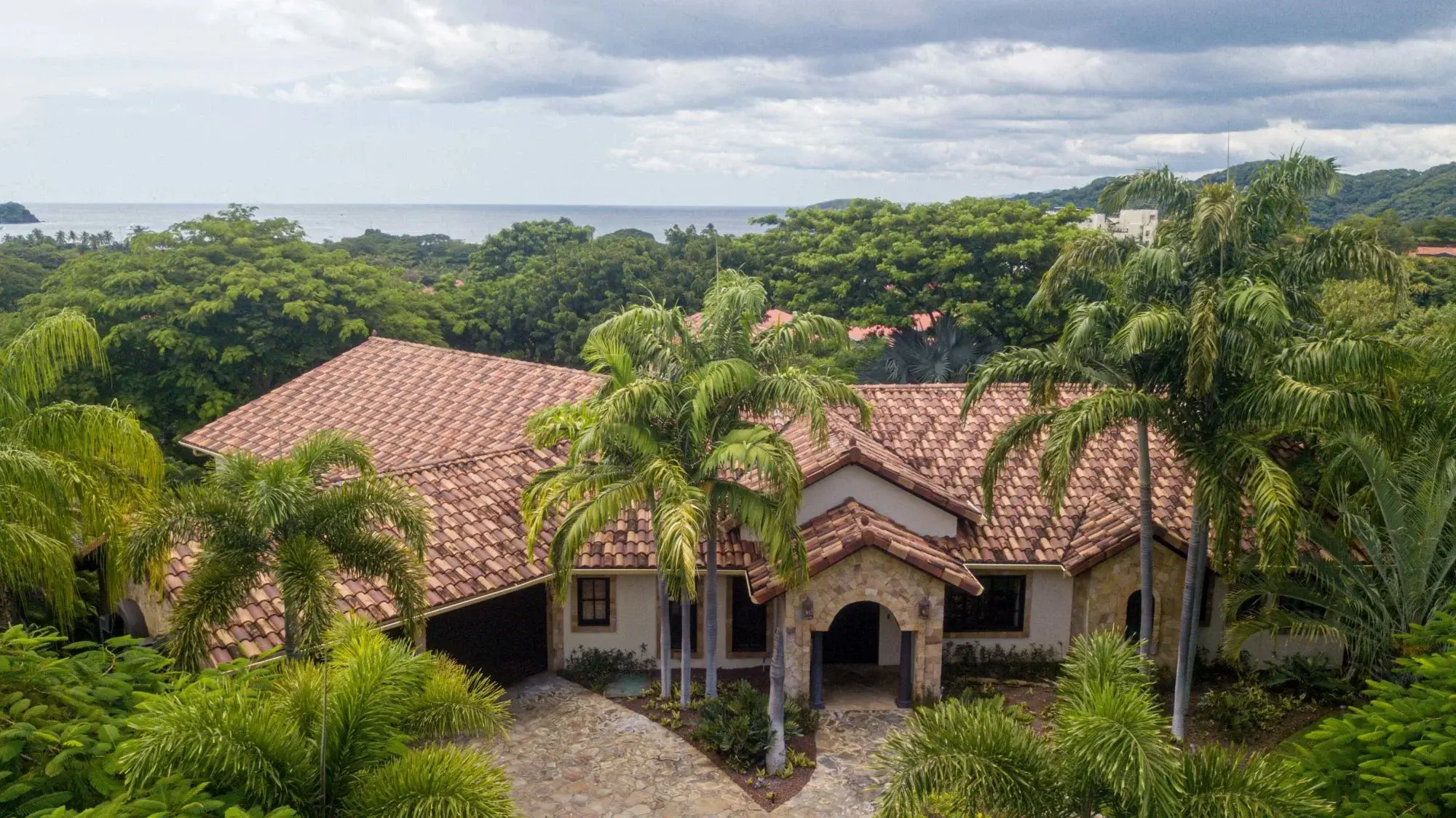Luxury villa in Costa Rica’s exclusive Pacifico development with five spacious and private full-size bedroom suites, infinity pool, and a terrace with an open-air pavilion.