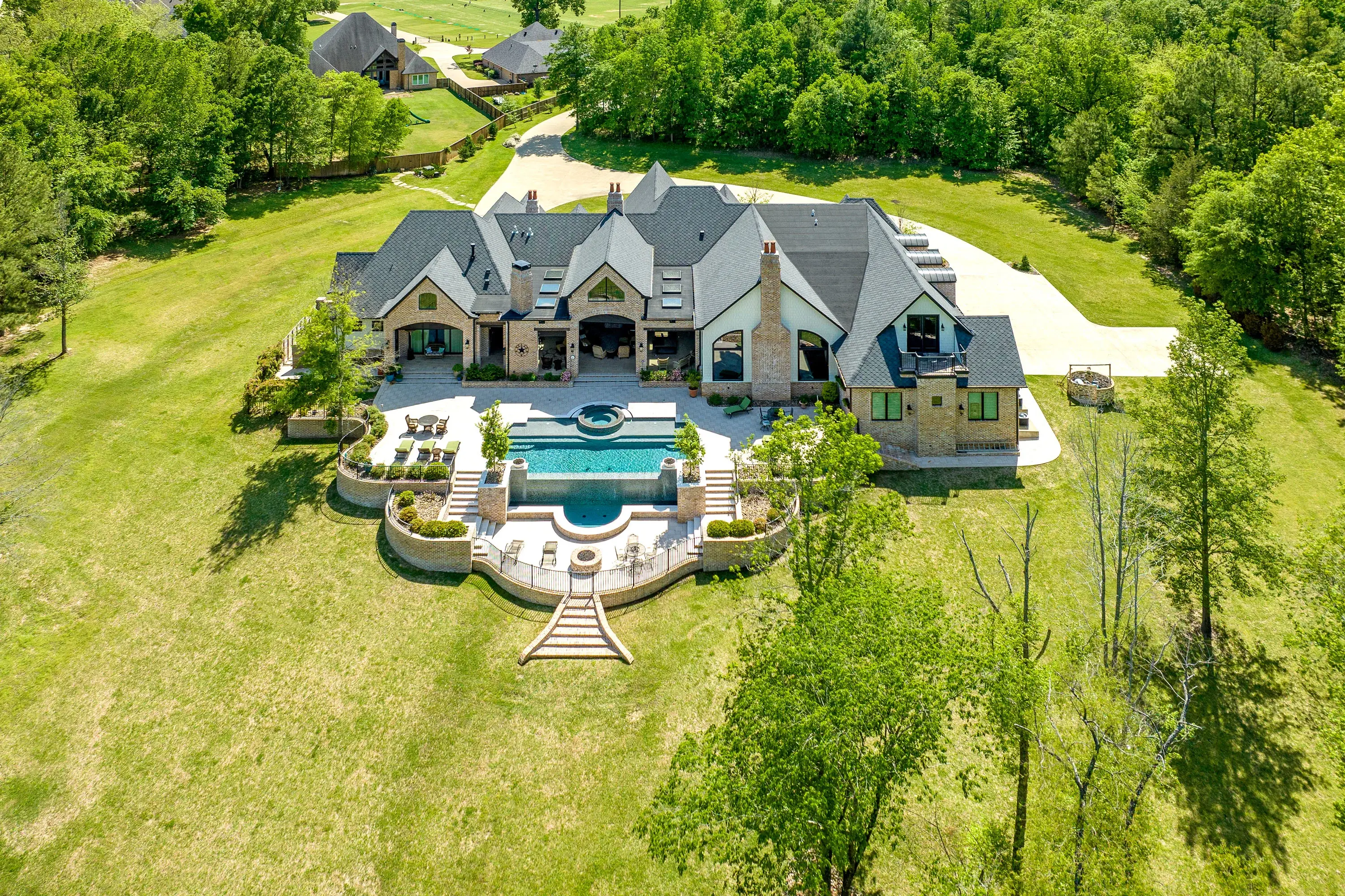 Elegance and tranquility converge at this sophisticated estate in Longview’s exclusive Champions Ridge. 