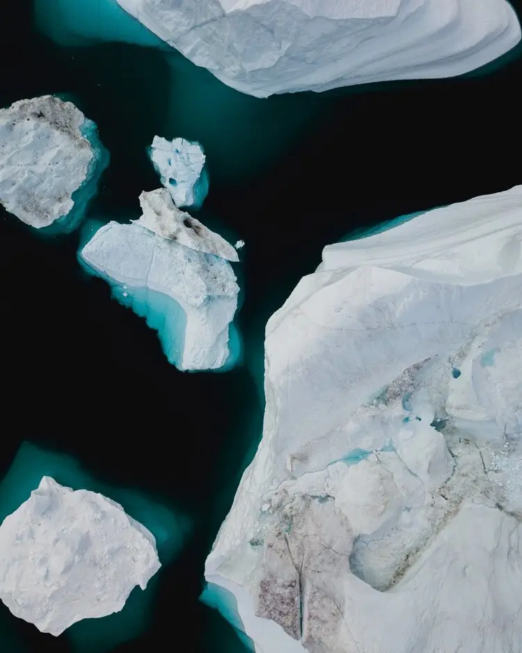 5 Small Polar Ice Caps Floating on water.