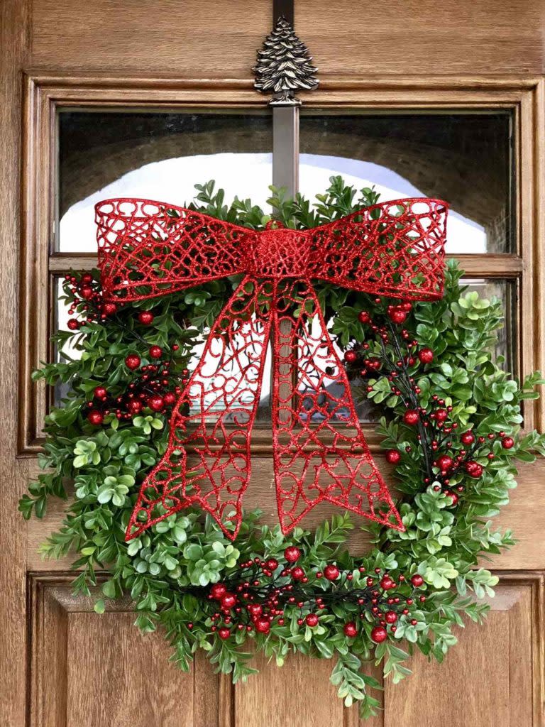 christmas wreaths on windows Beautiful Boxwood wreath from Hobby lobby I added berries and a bow for