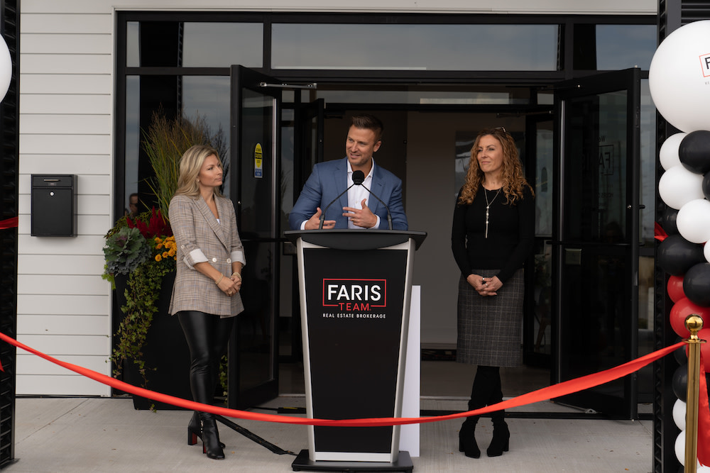 Mark Faris, CEO and Broker of Faris Team delivering his speech at the Grand Opening on October 6th. Joanna Faris, Co-Founder (left) and Rachelle Layes, President (right), looking on. 