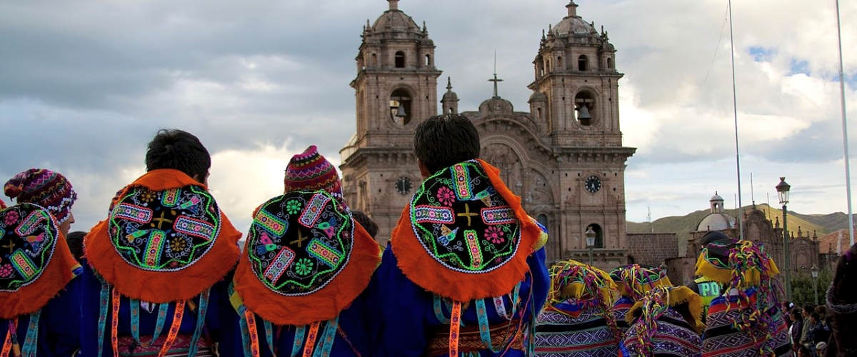 Dancers in traditional costume for parade in Cusco Plaza de Armas in Peru
