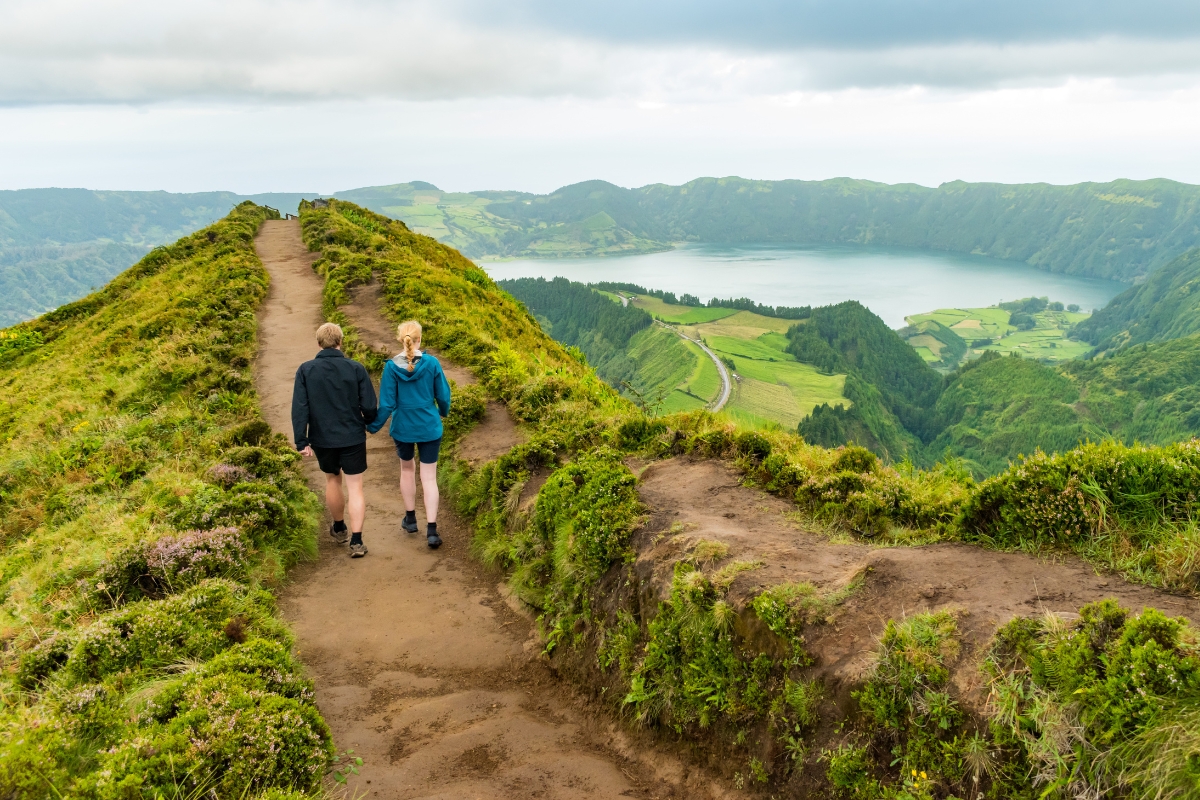 Couple walking on trail in Azores Islands, Portugal