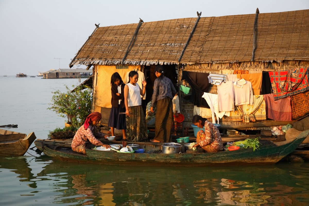 Locals life scene of boat and house in Tonle Sap Lake Siem Reap Cambodia