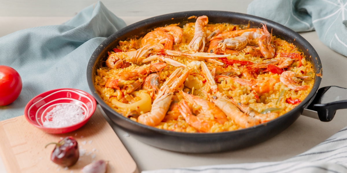 Seafood paella in a pan, Spanish food dish cuisine
