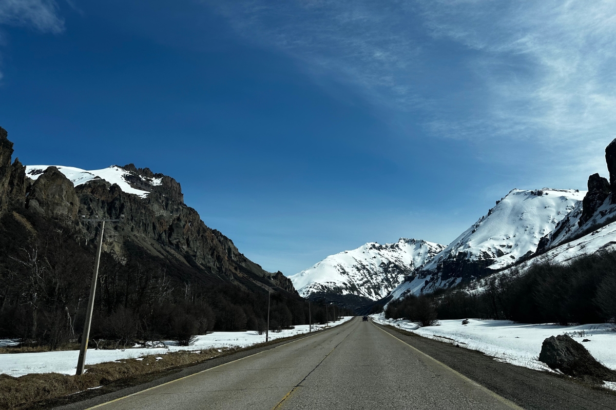 Road and snowy hills and mountains in Aysen, Chile