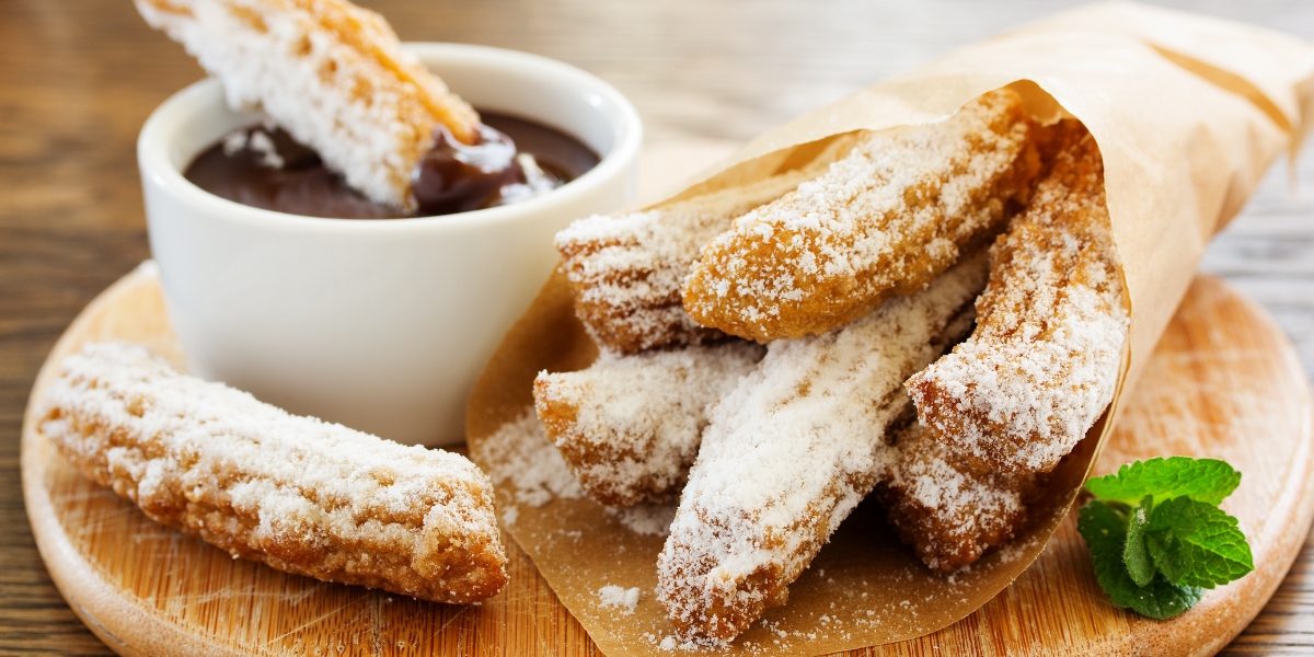 Churros and melted chocolate, Spanish food dessert cuisine