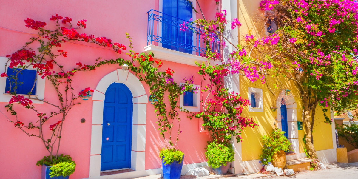 Colorful building with pretty flowers on the streets of Kefalonia, Greece
