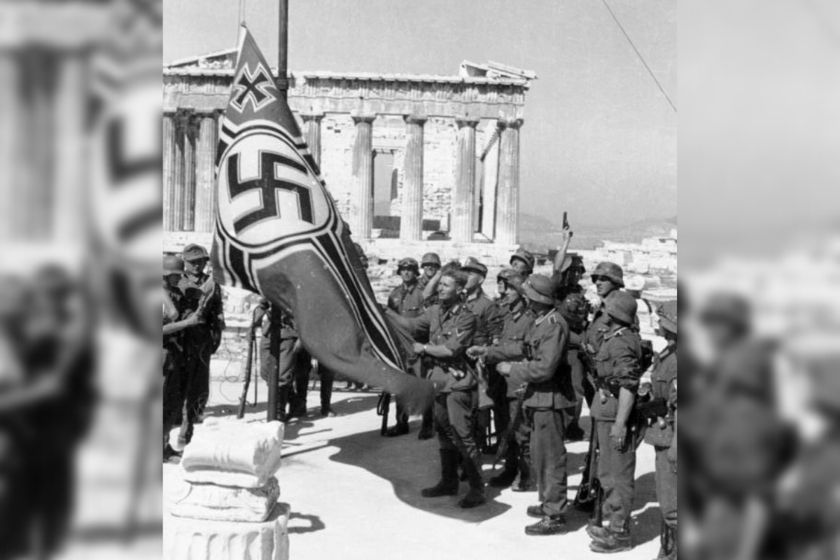 German soldiers raising the German War Flag over the Acropolis of Athens in 1941