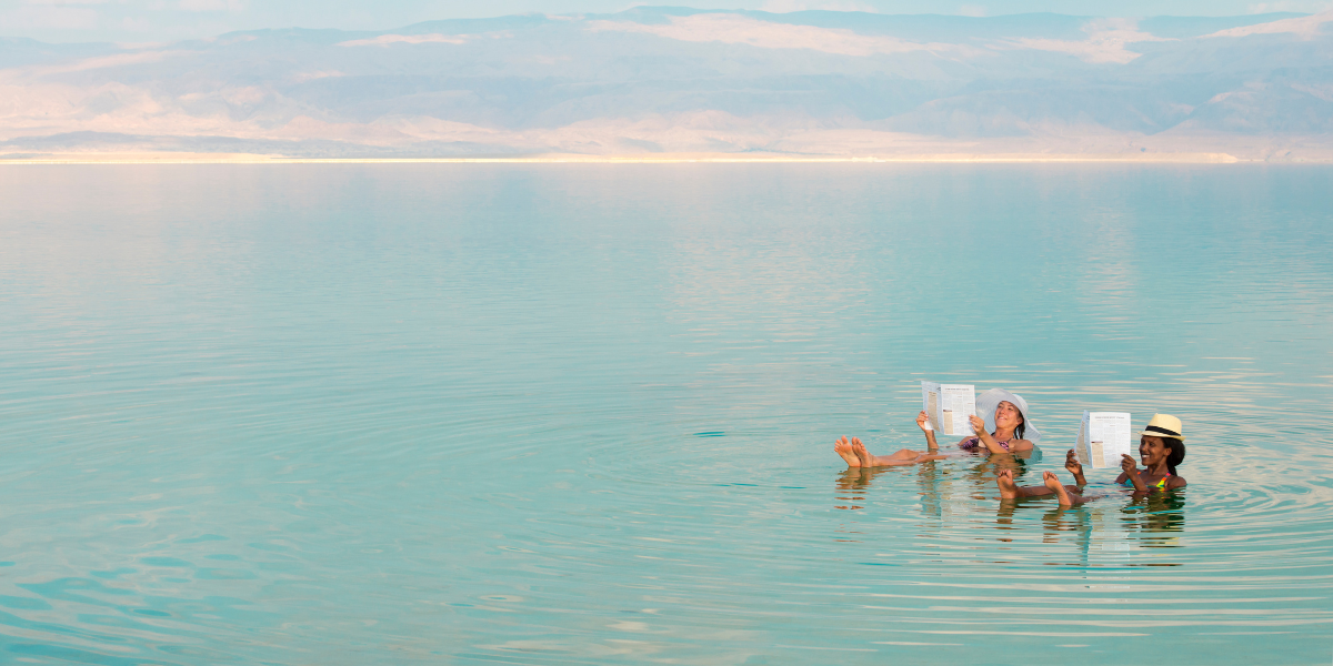 People floating in the salty Dead Sea near Jordan and Israel