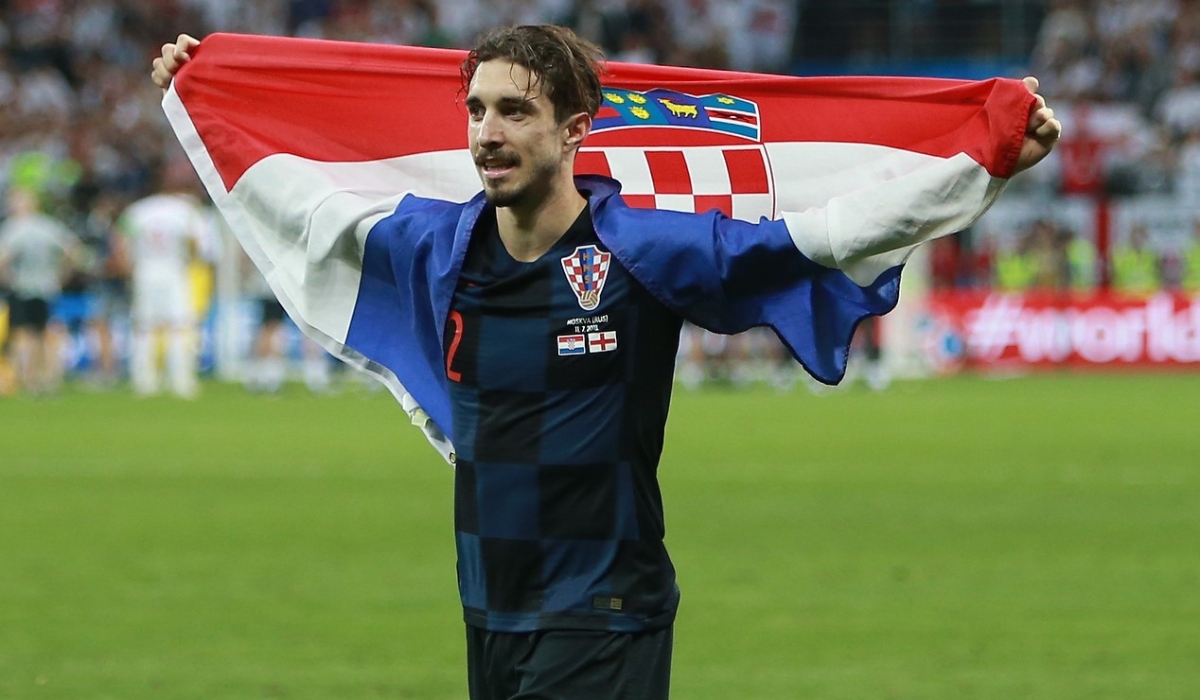 Šime Vrsaljko footballer soccer player of Croatia national football team holding flag in 2018 FIFA World Cup