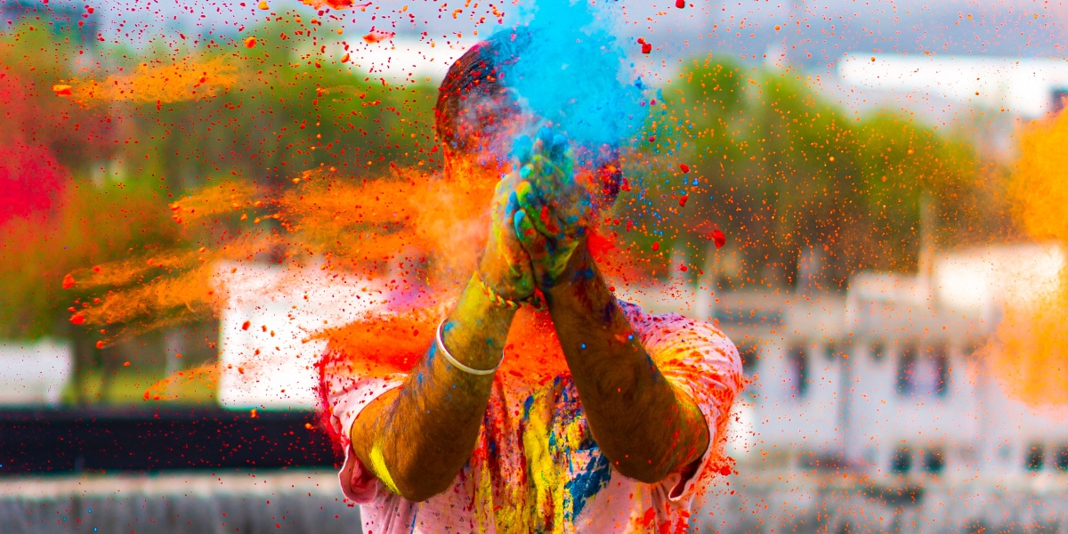Throwing colorful powder at Holi Festival in India