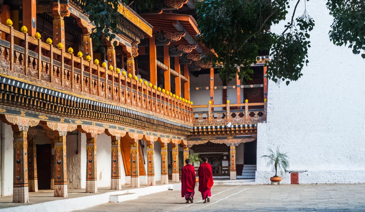 Two buddhist monks at Punakha Dzong in Bhutan