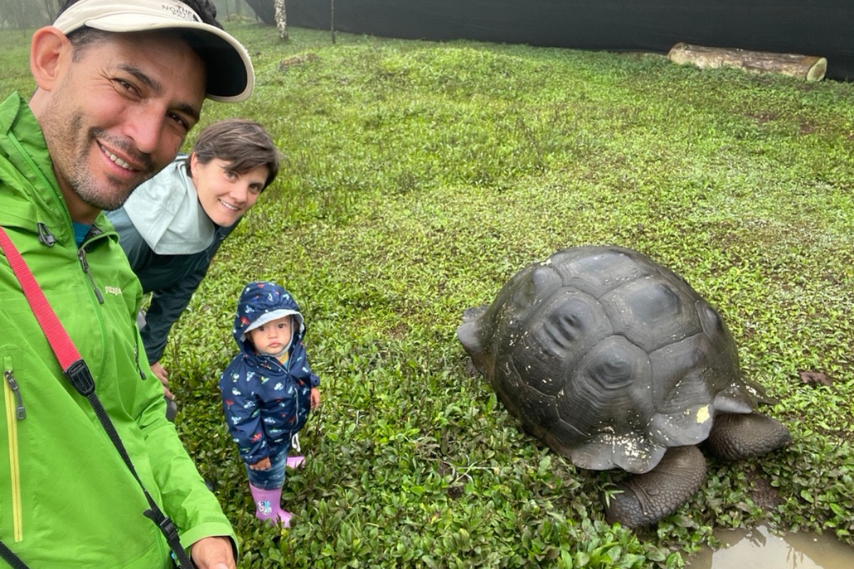 Hayley Ward SA Expeditions Destination Expert family with giant tortoise at Galapagos Islands, Ecuador