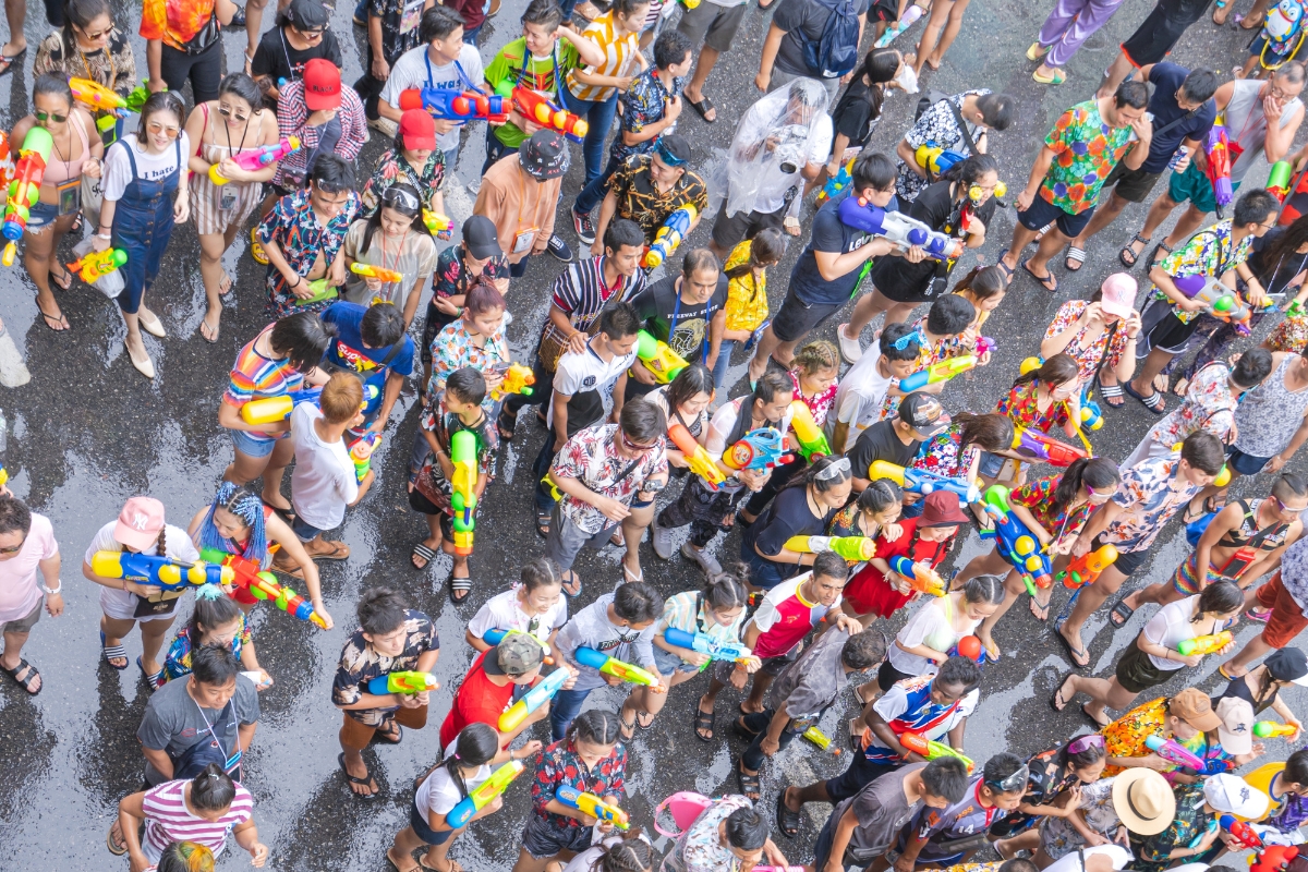 A crowd of people with water guns at Songkran festival Thai New Year in Thailand