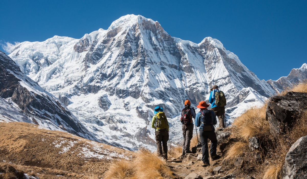 Trekking in Annapurna region, with Annapurna South in background, Nepal