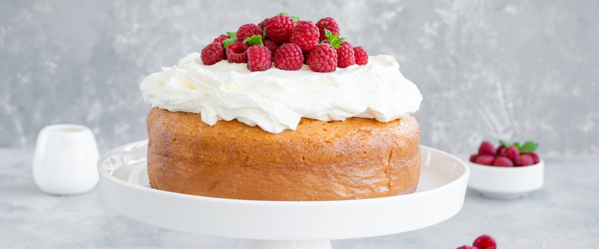 Tres leches cake with whipped cream and raspberries, Panama cuisine dessert