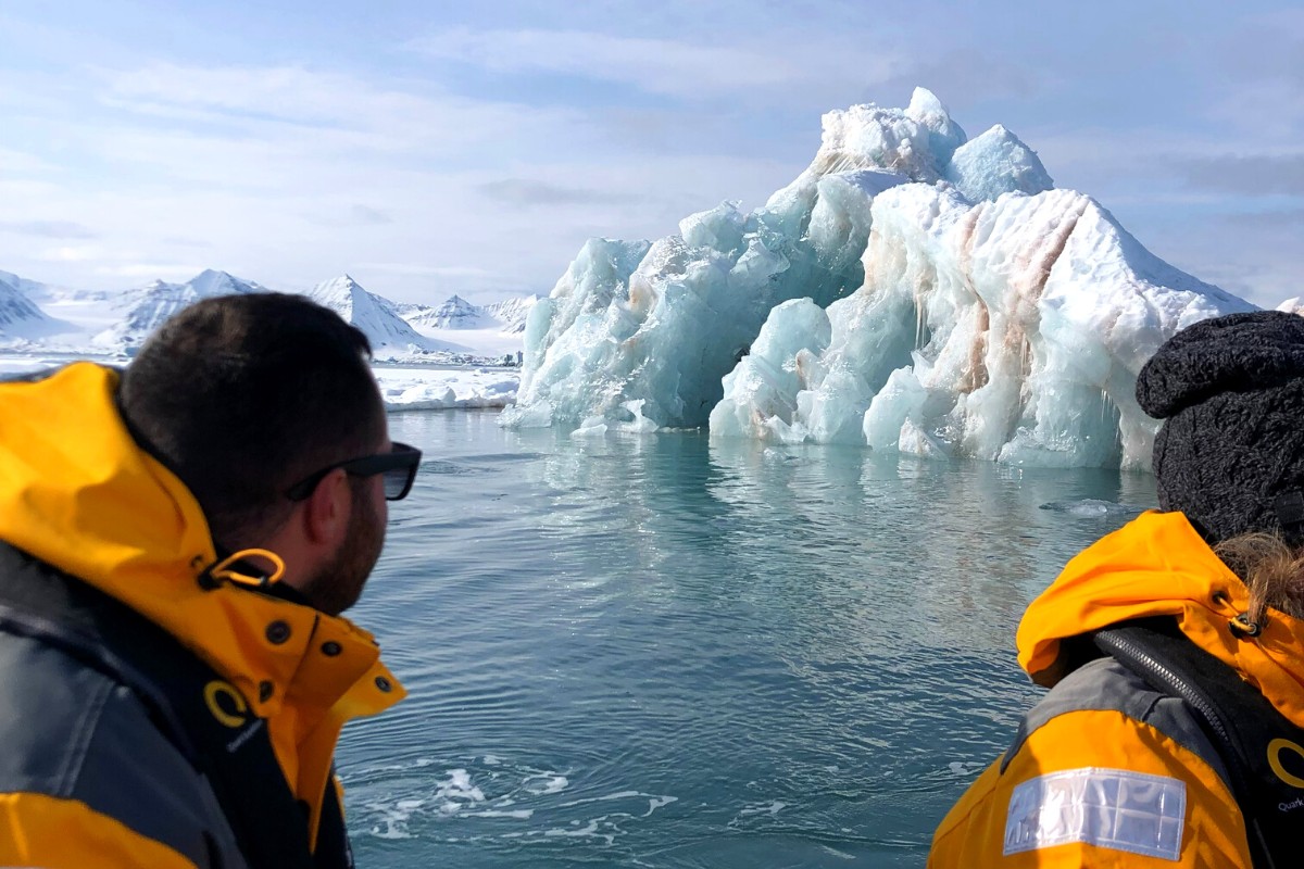 SA Expeditions Destination Expert Adam Laughter in the Arctic, zodiac spotting icebergs