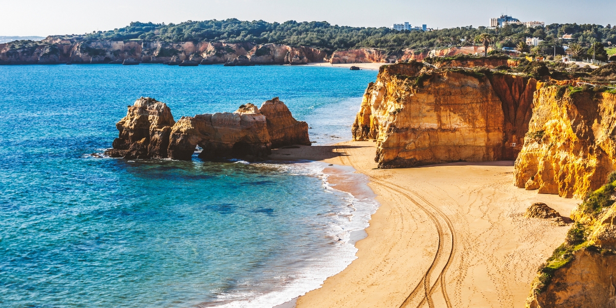 Beautiful Algarve golden sand beach at Praia dos Tres Castelos in Portugal