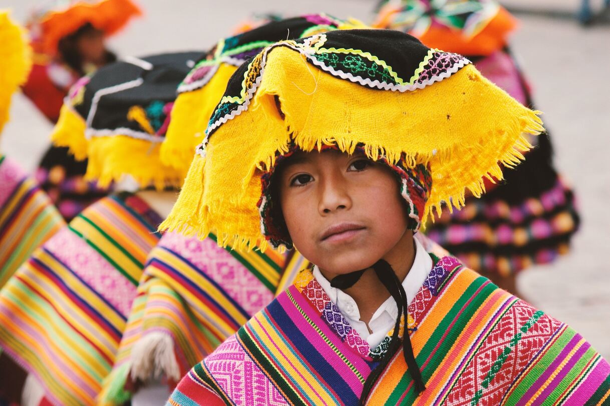 A boy from the Cusco region in traditional festival garb