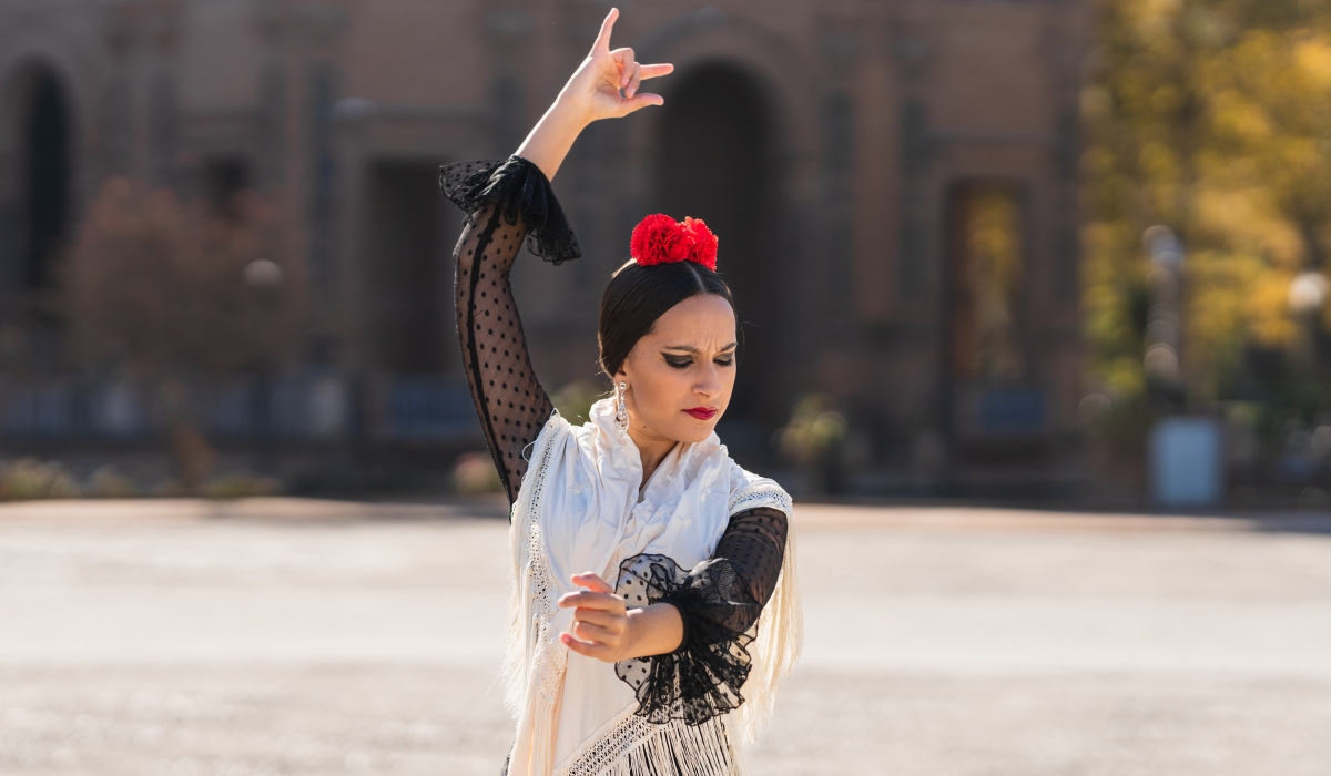 Spanish Woman Dancing Flamenco Outdoors in the Plaza de España, Square of Seville, Spain