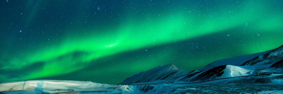 Northern lights, or aurora borealis, among landscapes in Alaska