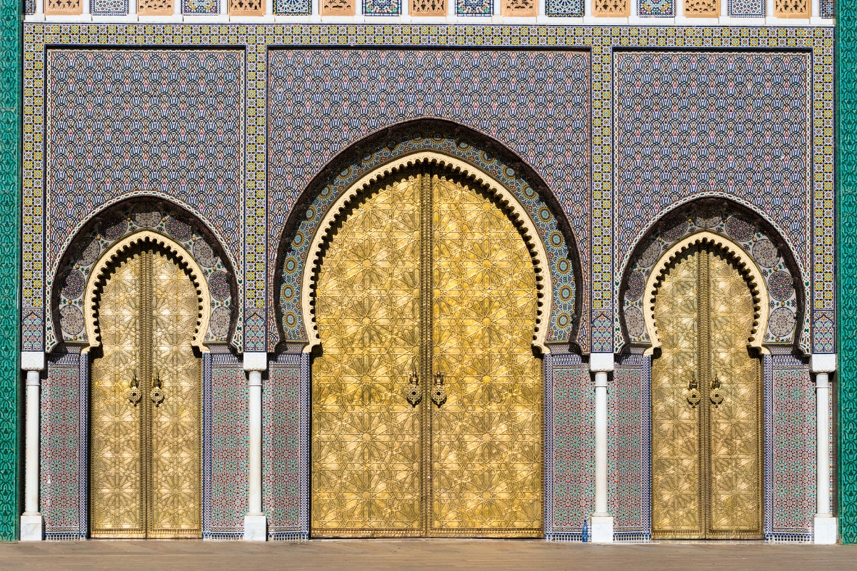 Brass gate and zellige mosaic tilework on Dar al-Makhzen royal palace in Fes, Morocco