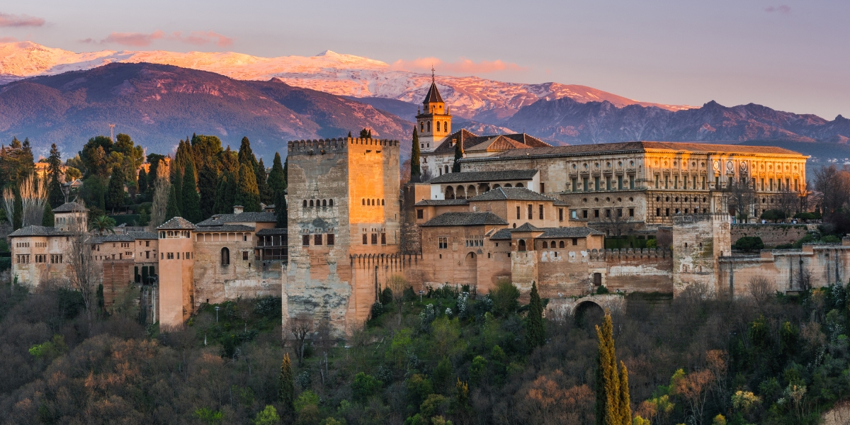 Arabic Palace Alhambra with mountain background in Granada, Spain