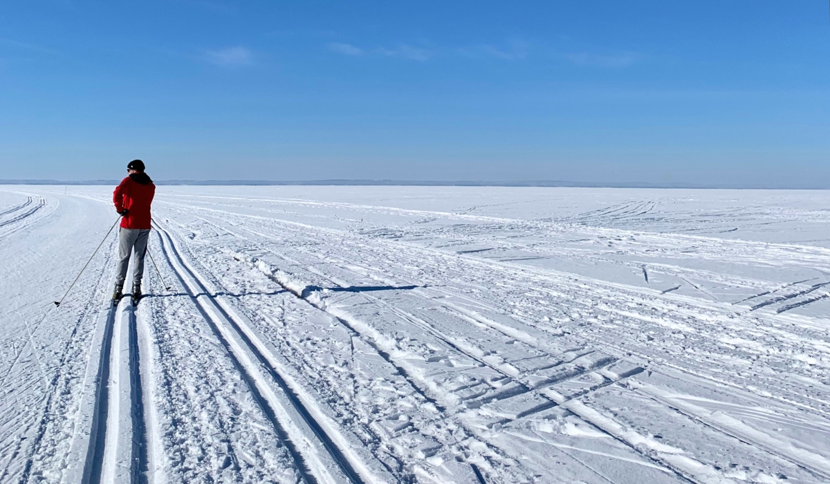 Cross-country skiing on frozen lake in Joensuu, Finland