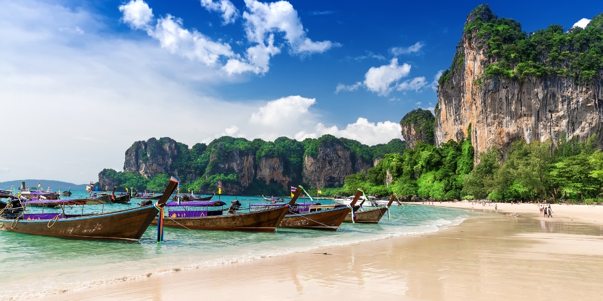 Boats docked at Railay Beach in Krabi, Thailand, Asia