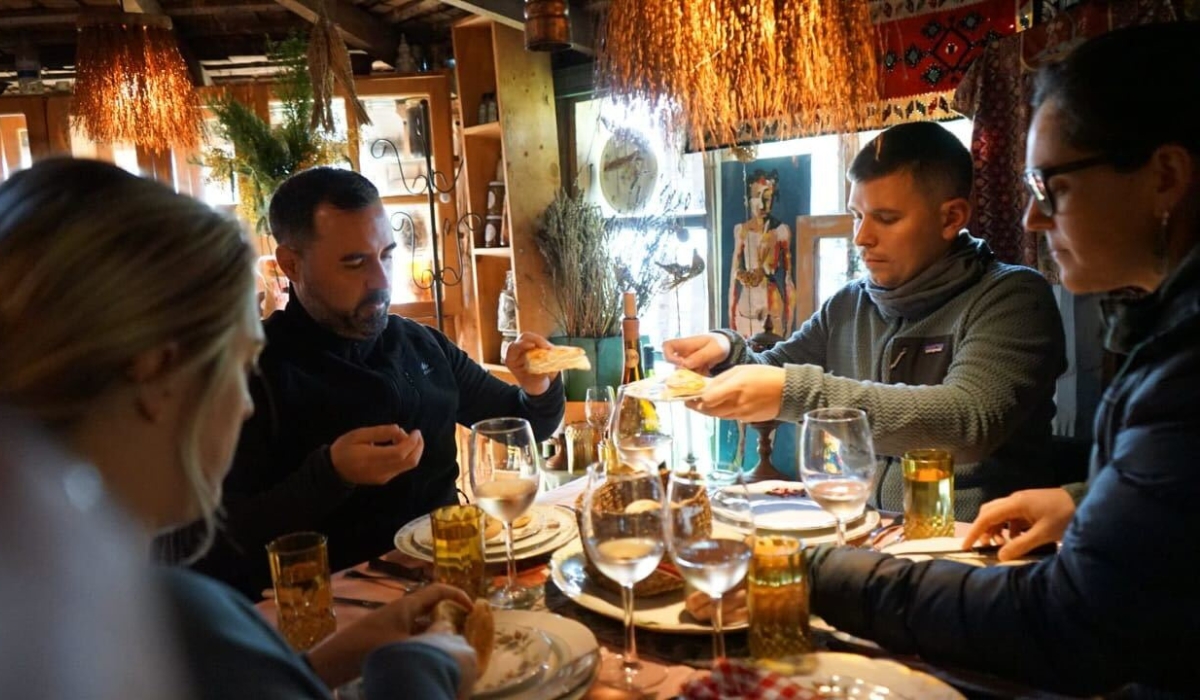 SA Destination Experts Megan, Gerry, Mikey having local meal in Chiloe Island, Chile