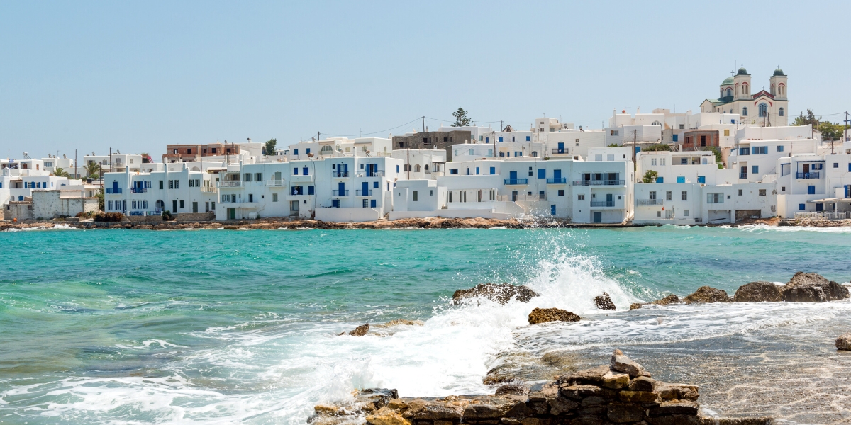 Naoussa harbor coast and white buildings in village of Paros, Greek island, Greece