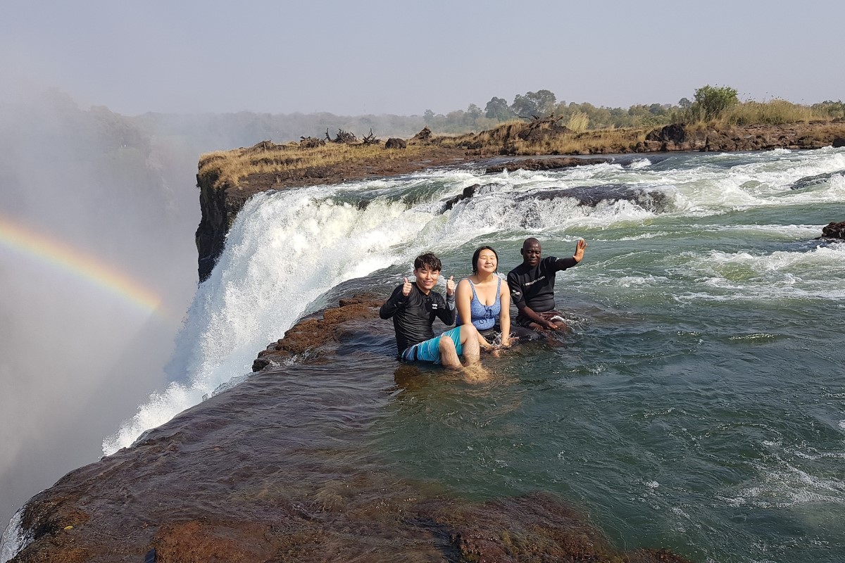 Visitors at the Devils Pool at Victoria Falls in Zimbabwe